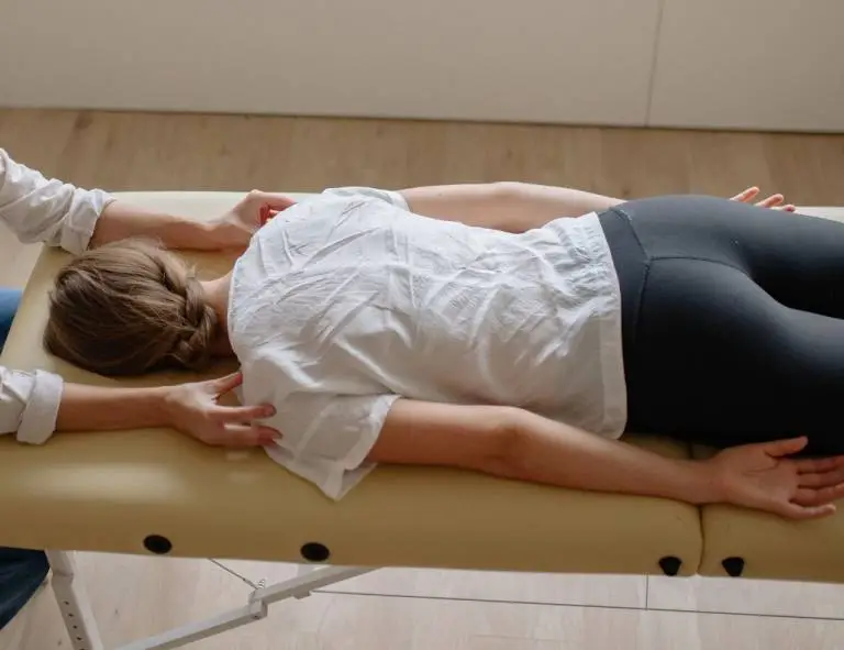 Client lying comfortably on a treatment couch during a sound healing with the voice session.